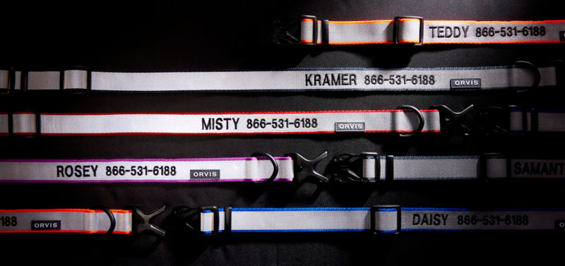 Several reflective collars laying flat next to each other.