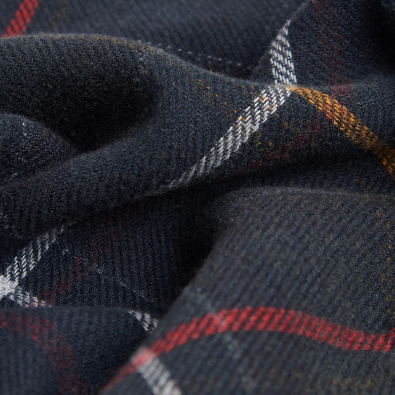 A close-up view of a plaid Barbour&reg; scarf.