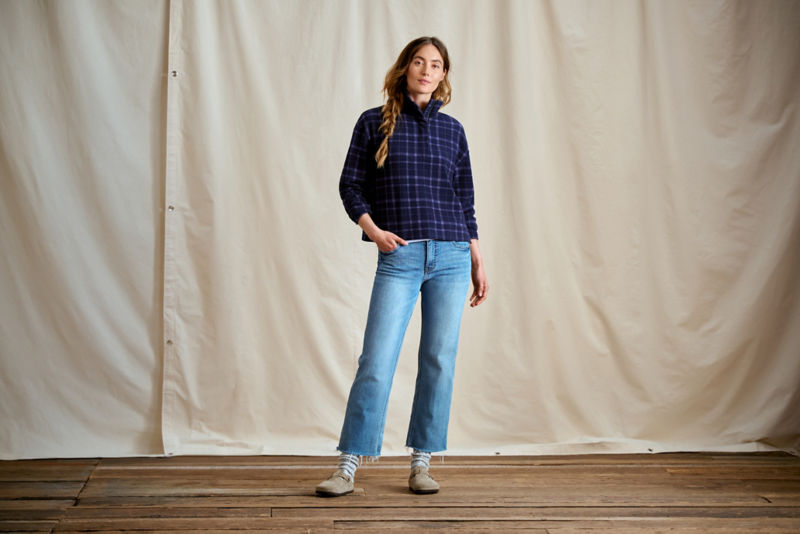 A model wearing a cobalt blue plaid fleece.