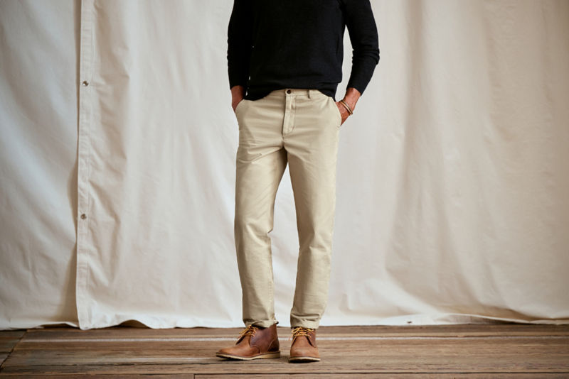 Model wearing light khaki pants with a black shirt.