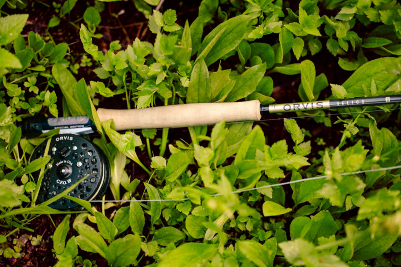 A Helios Fly Rod lays in the weeds with a CFO reel.