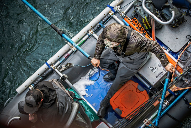 An aerial view of an angler rowing a small boat.