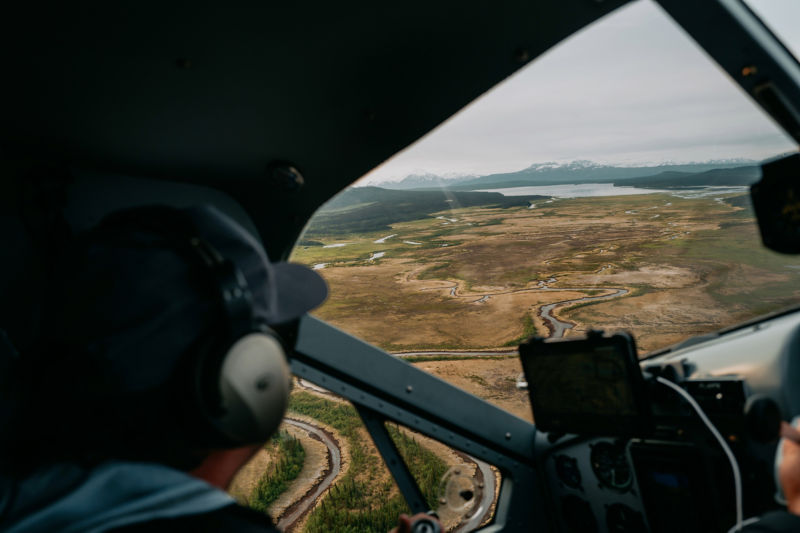 A view flying over Alaska from the inside of a small plane