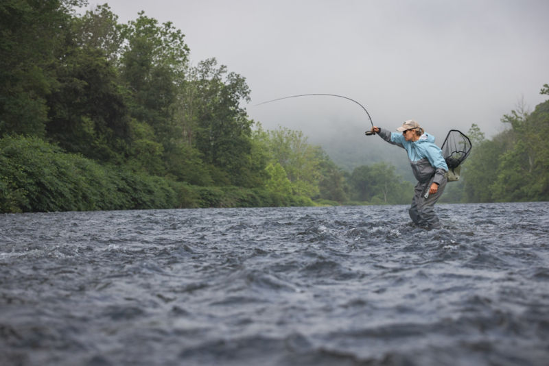 Anita Colton braces herself for the hook from ankle-deep in a river.