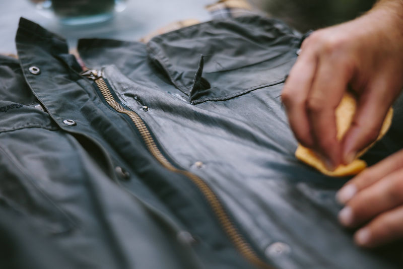A Barbour jacket in the process of being re-waxed.