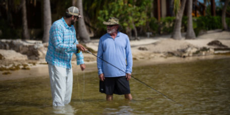 Pete Kutzer teaching a man how to fish