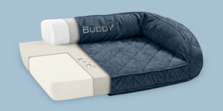 A cutout showing the insides of a dark blue dog bed on a blue background