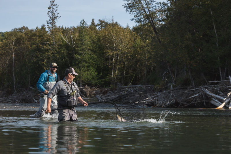Two anglers celebrate a catch