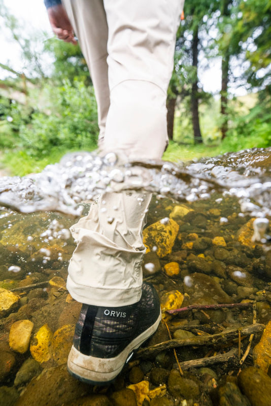 A shot of Camo PRO wading shoes below the water.