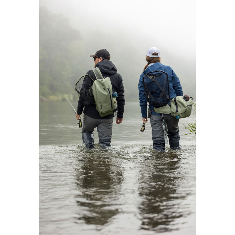A couple of anglers wade downriver with their PRO Waterproof gear.