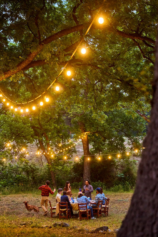 A group of people eat dinner after a day of hiking. FloridaS25_2488
