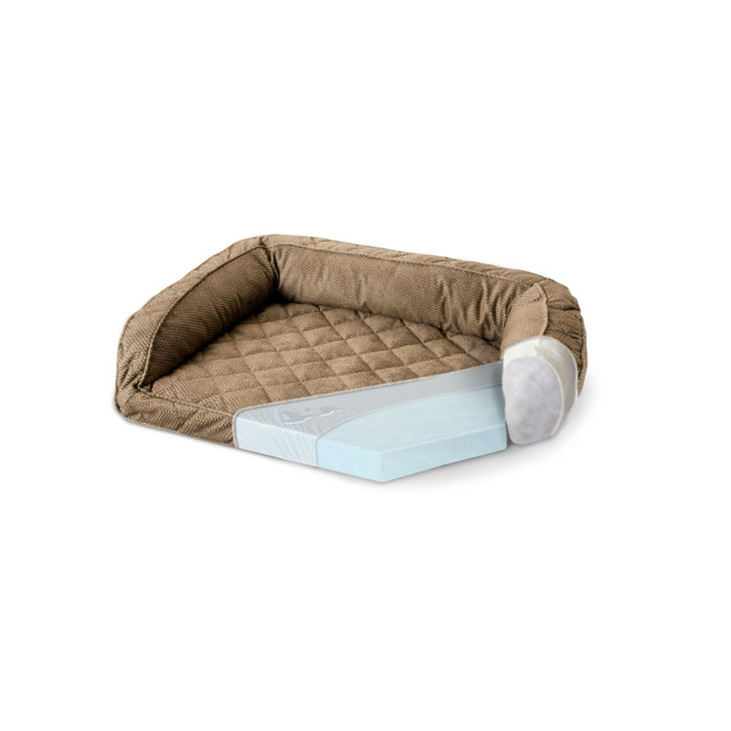 A cutout showing the insides of a tan dog bed on a white background.