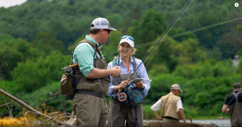 A Orvis instructor talks with a beginner.