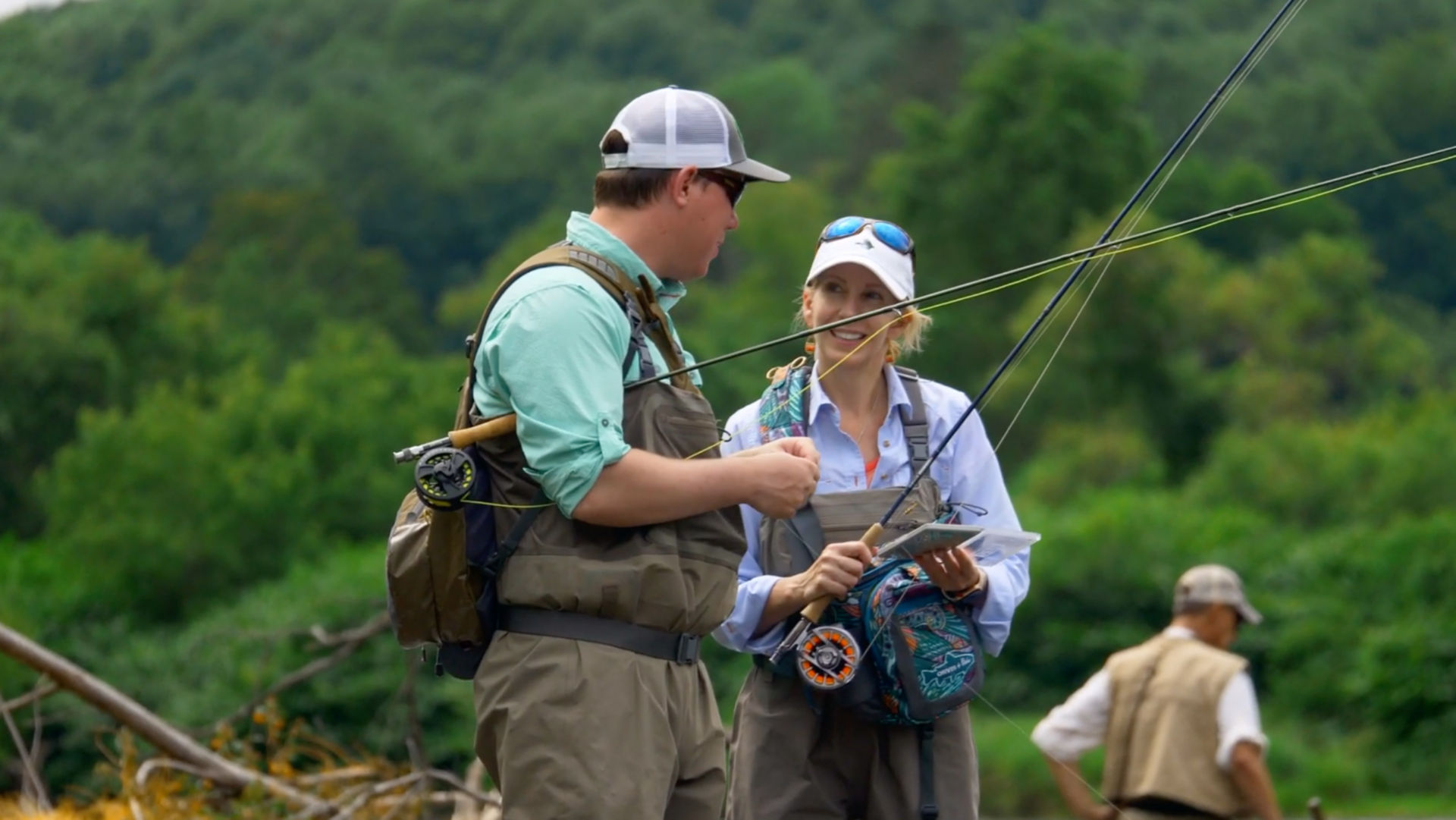 A Orvis instructor talks with a beginner.