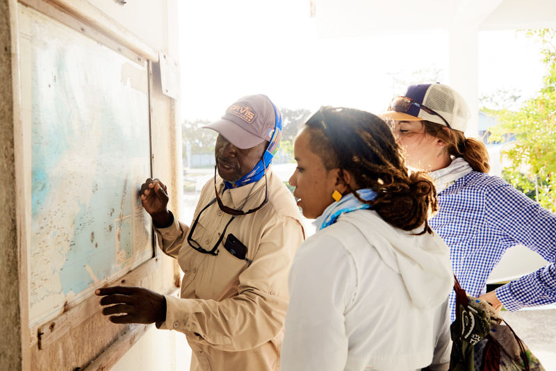 A guide shows anglers a map of the route they intend to take.
