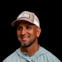 A headshot of Capt. Benny Blanco in a tan Orvis ball cap