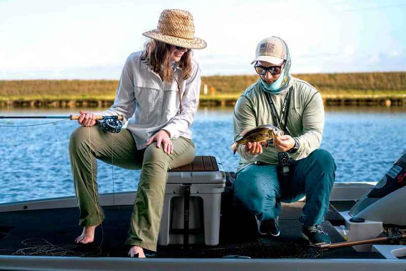 Hannah and Simon examine a just caught fish