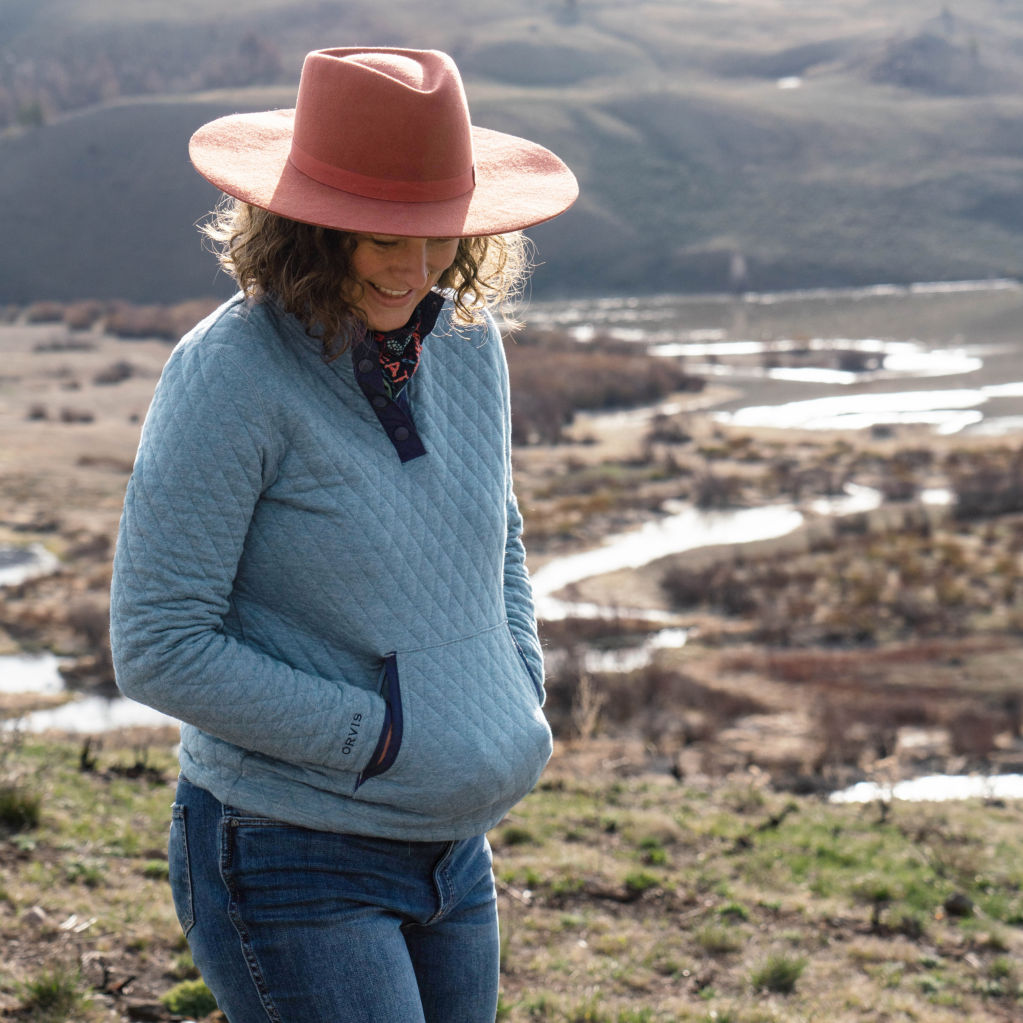 Woman overlooks marshland in a Bluestone Outdoor Quilted Sweatshirt.