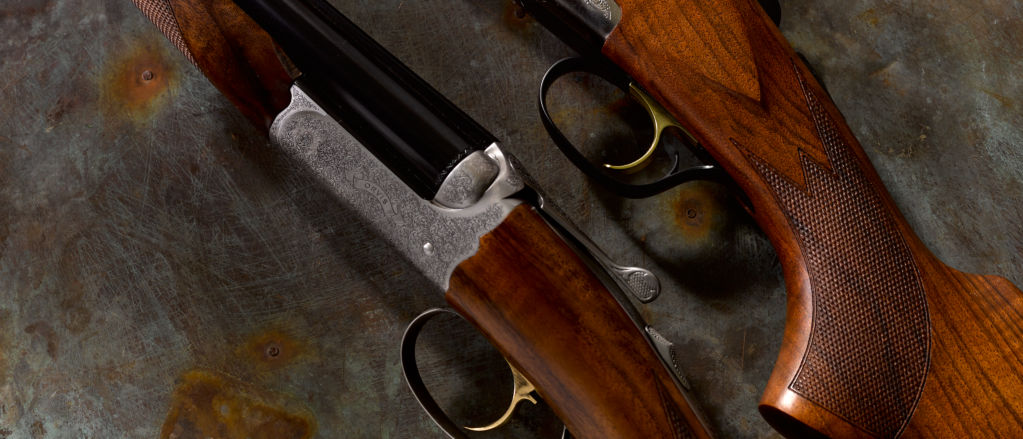 Closeup of intricately carved shotgun stocks
