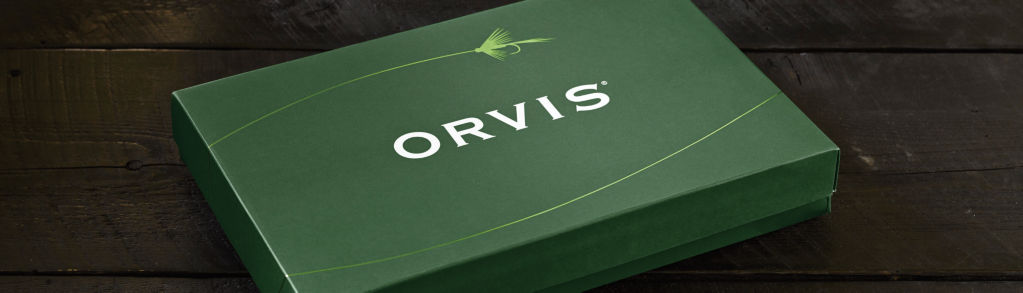 Orvis Gift box sitting on a dark wood background
