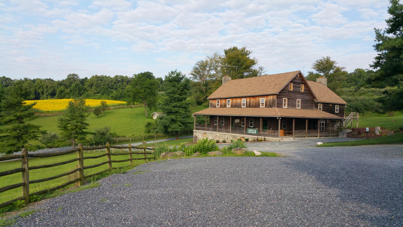 The wooden lodge at Hill Country Shooting Grounds.