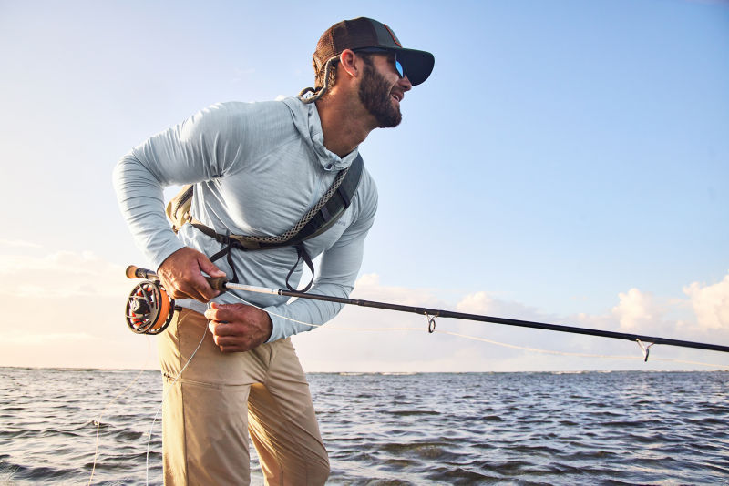 A man wearing UPF clothing and accessories