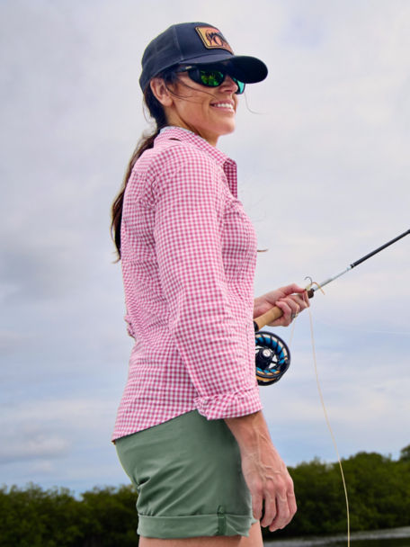 Woman fishing in L/S River Guide shirt