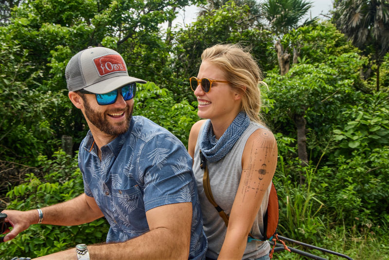 Woman on back of motor bike