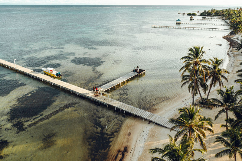 An aerial view of scenic dock in El Pescador, Belize.