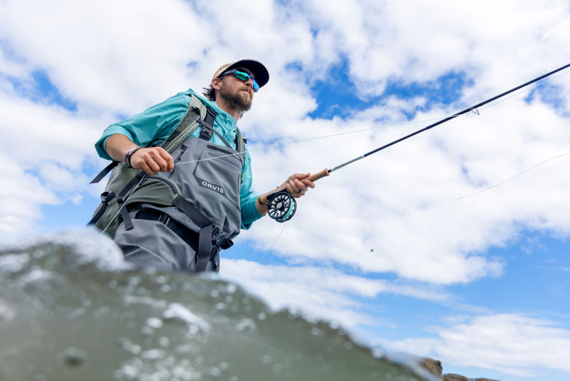 A view from the water of a wading angler.