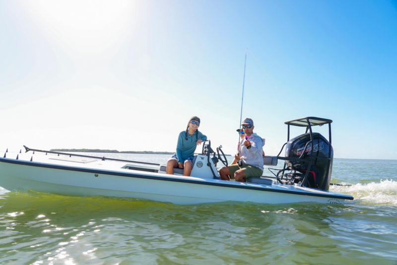 Benny Blanco and his daughter fish from a motorboat on the ocean.