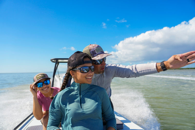 Benny points out the sights to his daughter while his wife peeks over her shoulder.