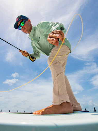 A shot from below of an angler working his line