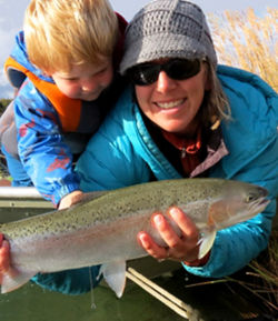 Nelli Williams and a boy admiring the fish they caught