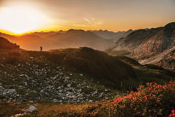 Hiker in a mountain at sunrise