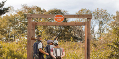 Three people in a shooting stand