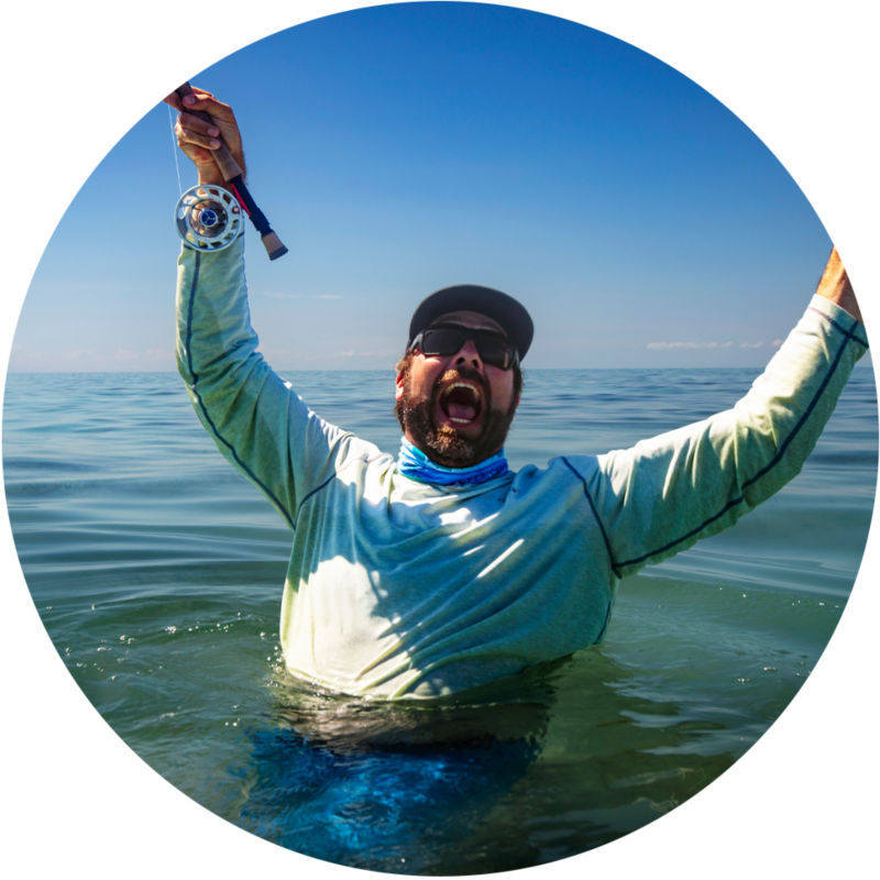 Pete Kutzer celebrating a win chest-deep in the ocean.