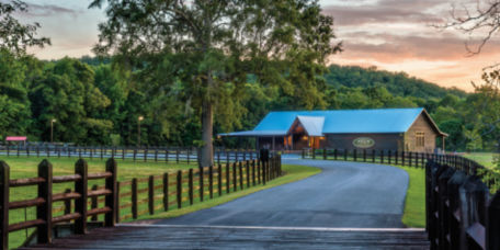 view of fences and hunting lodge at Pursell Farms