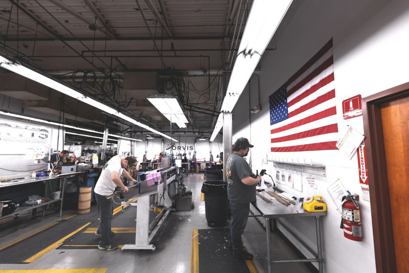 The interior of the Rod Shop filled with machinery and employees building rods