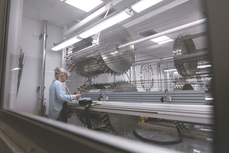 A Rod Shop employee builds a new fly rod.