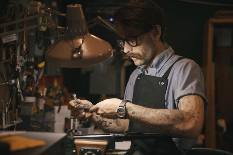 A gunsmith at his workbench.