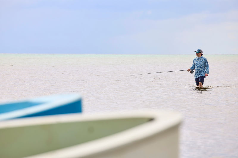 Man fishes in the ocean