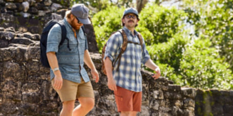 Two men walking through a cultural site in Mexico