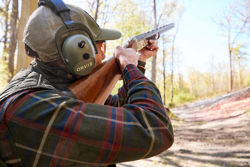 A hunting student shoots clays at the range.
