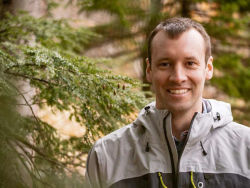 image of Simon Perkins standing in the forest