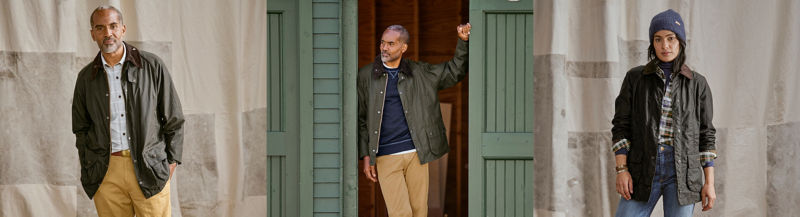 Three models wearing three different classic Barbour jackets.
