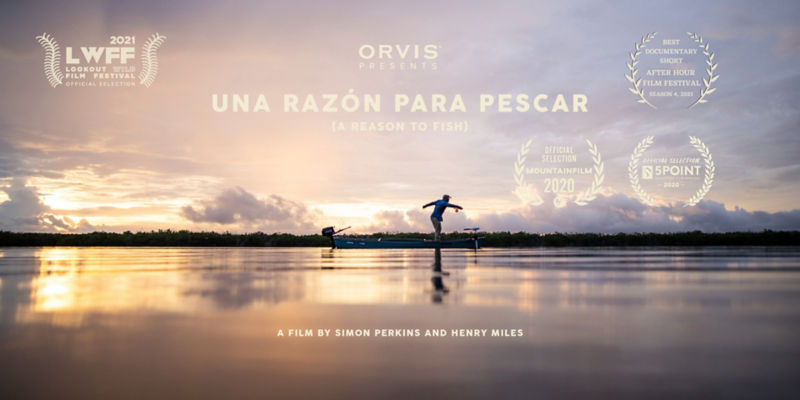 A landscape image of a small boat on the Florida Bay at sunrise.