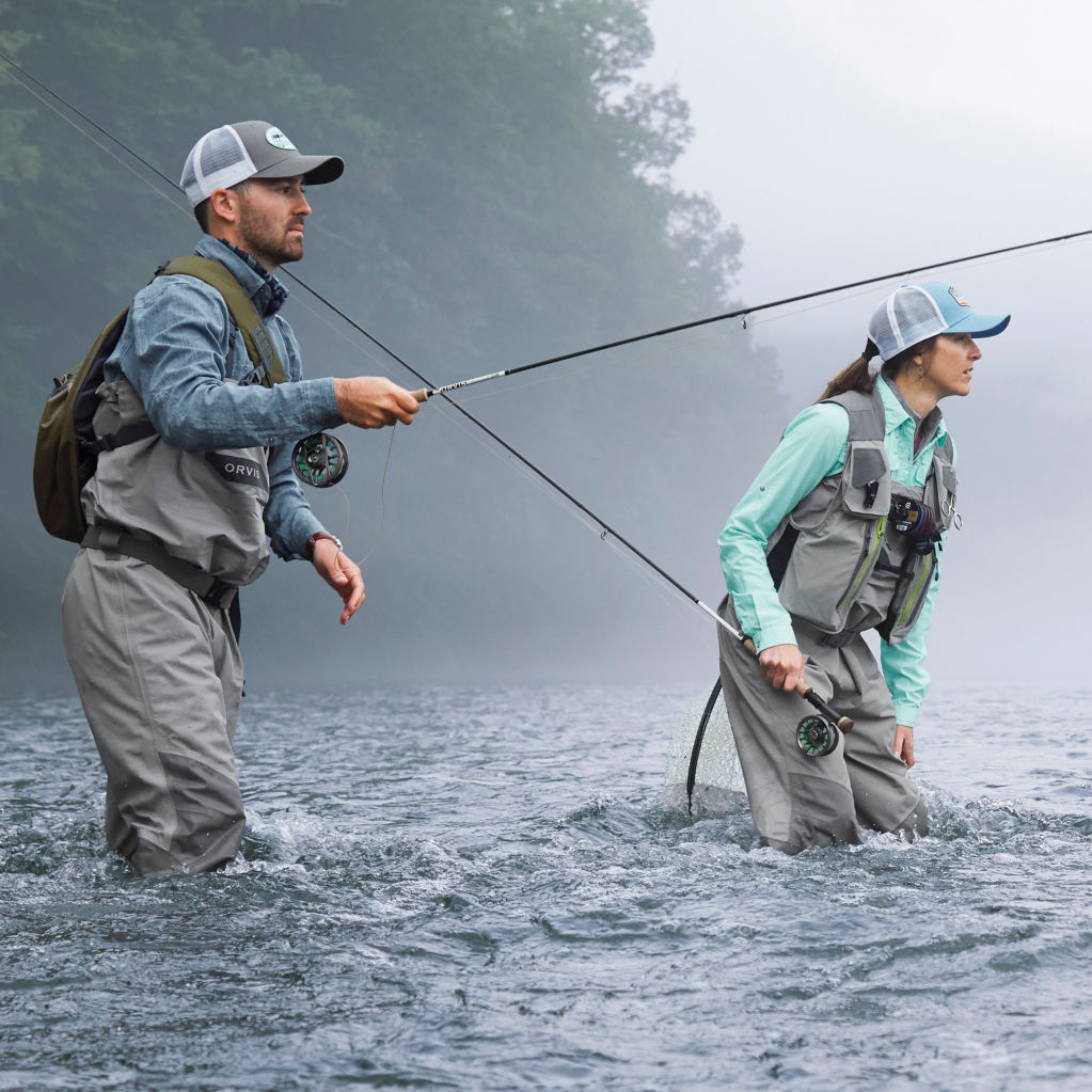 Couple in river using clearwater rods and reels.