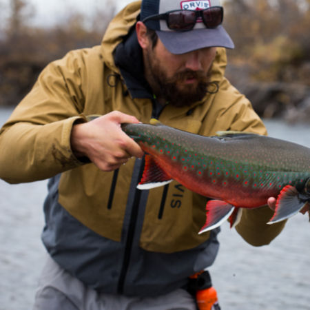 Man holding a salmon in Alaska