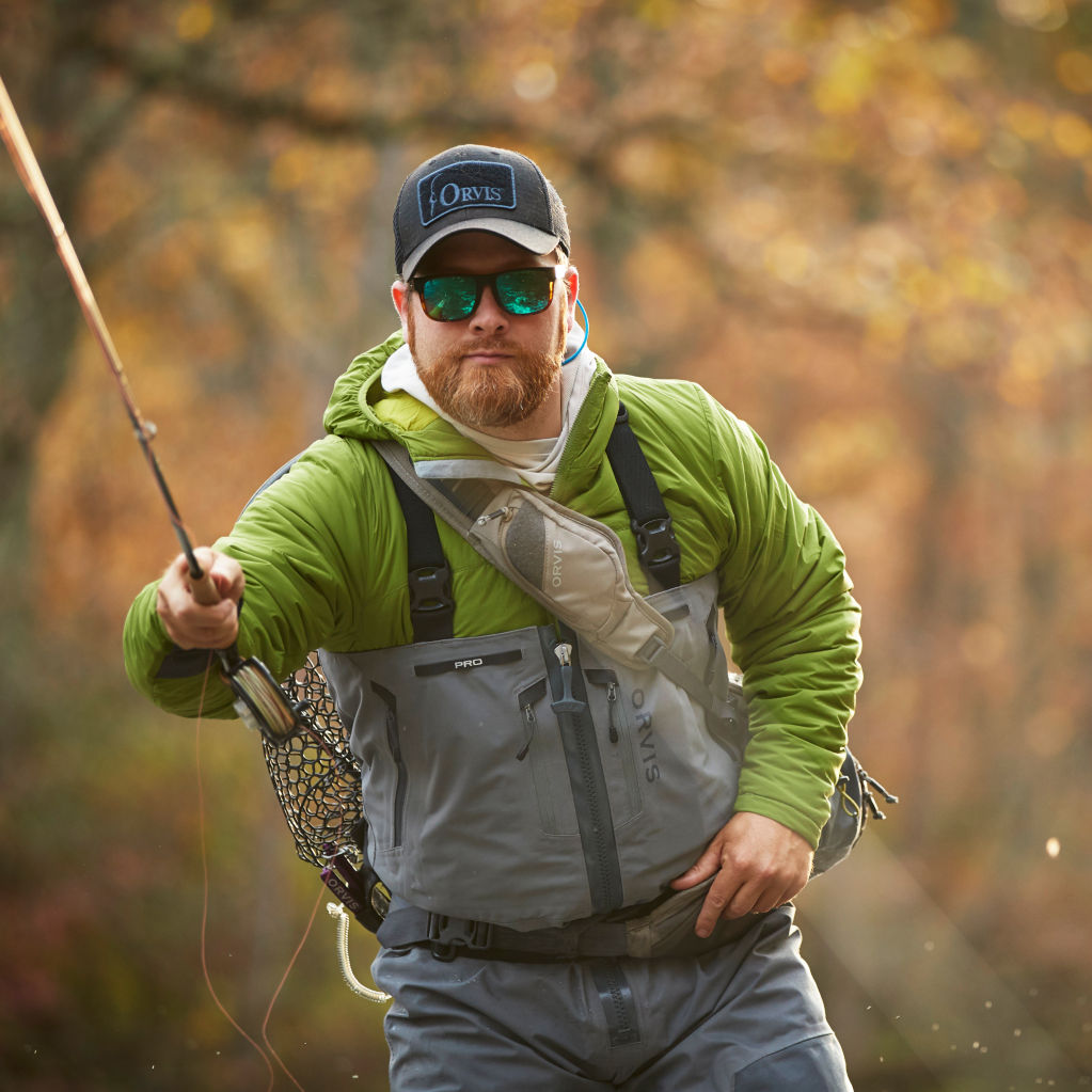 Men's PRO Zip Wader in action as angler shoots line upriver.